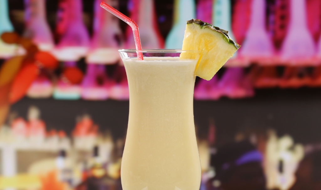 Pina Colada in Hurricane Glass with Pineapple Wedge