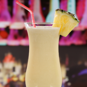Pina Colada in Hurricane Glass with Pineapple Wedge